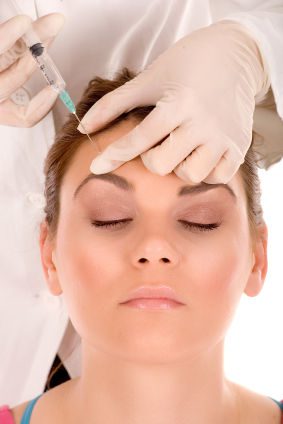 woman receiving botox injections in forehead